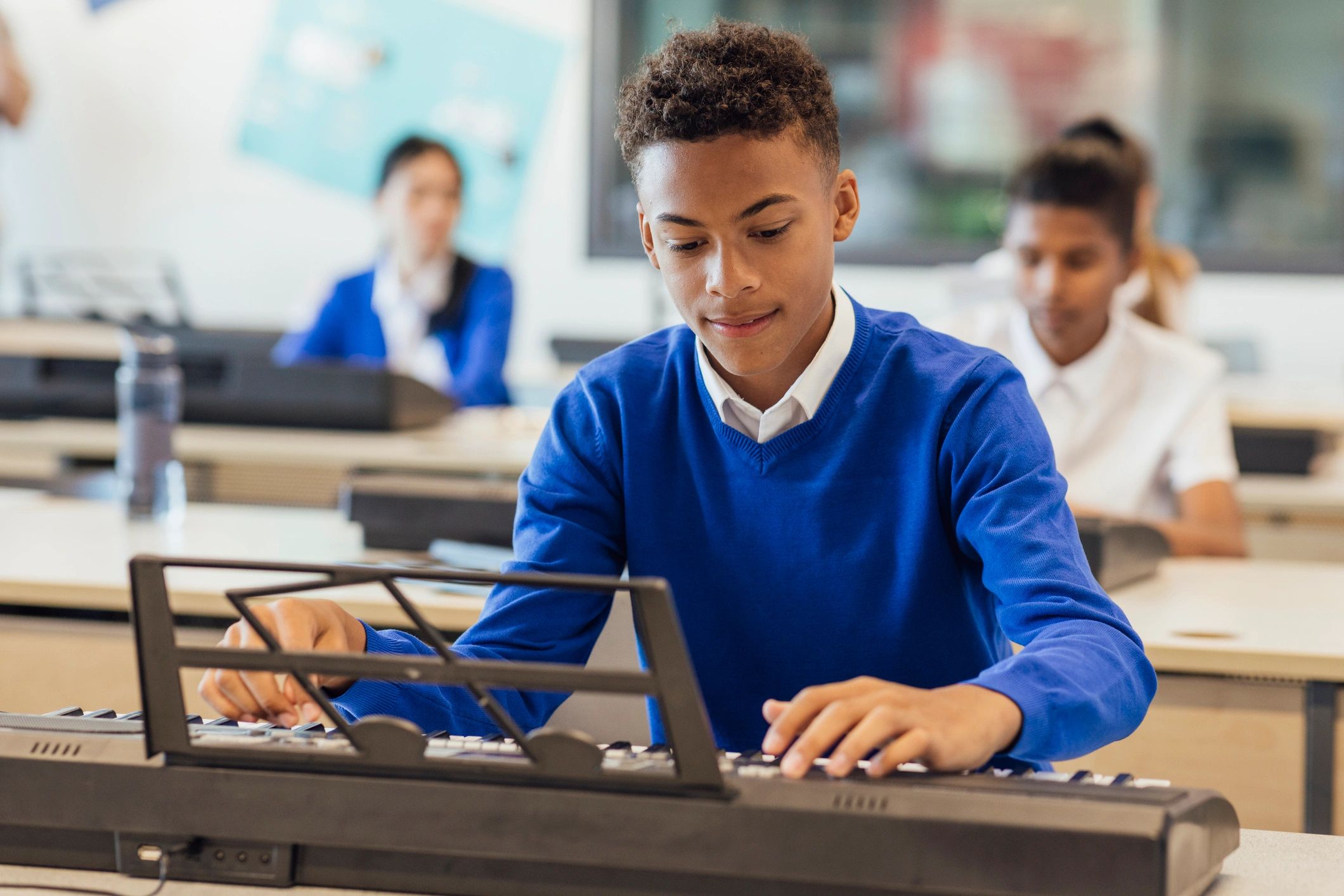 students learning music instruments