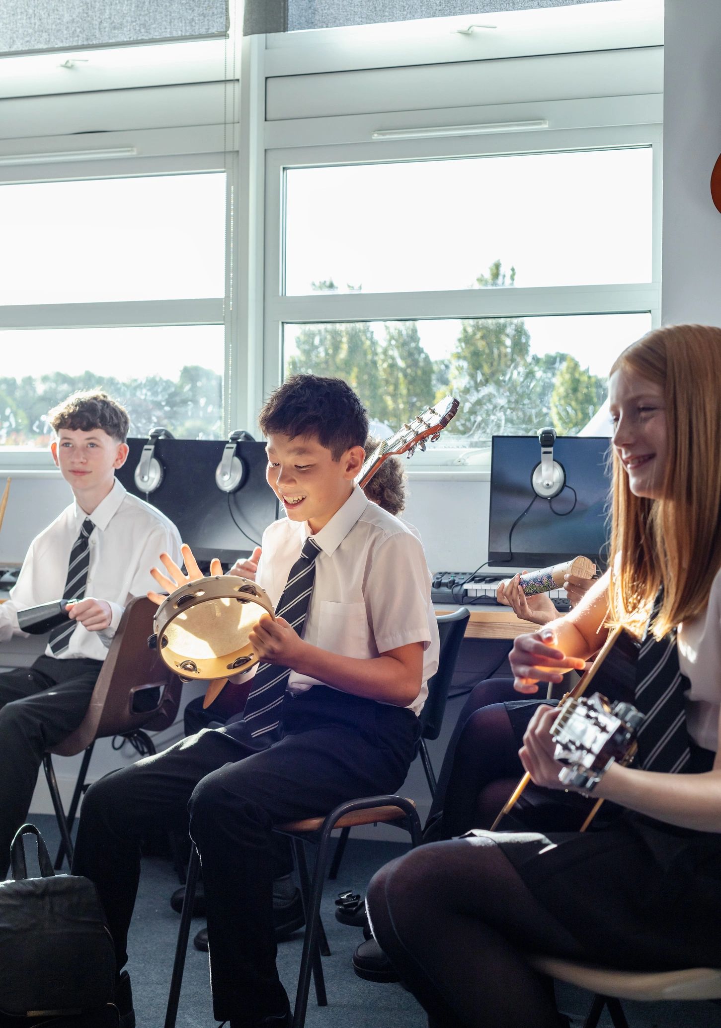 students learning music instruments