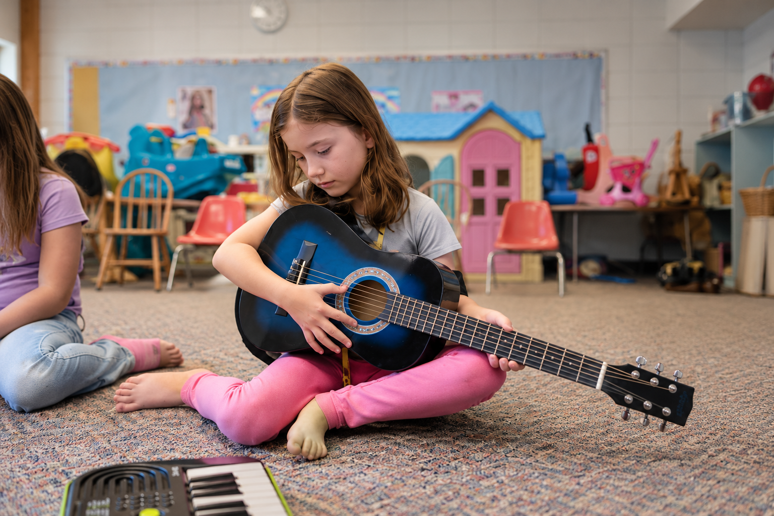 Girl playing guitar in class